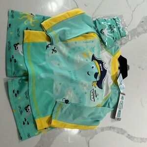 Tommy Bahama size 3T swim set. (3 pieces: hat, shirt, and trunk). New with tags.